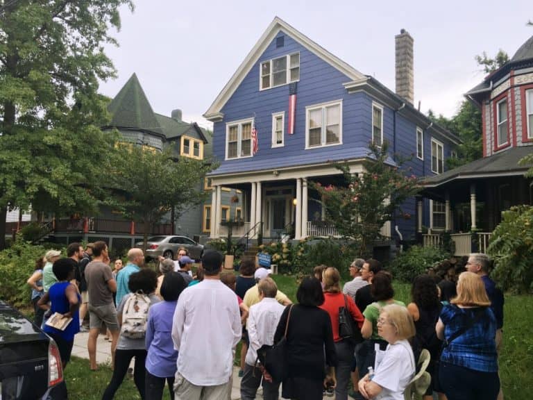 Group of attendees in front of a house