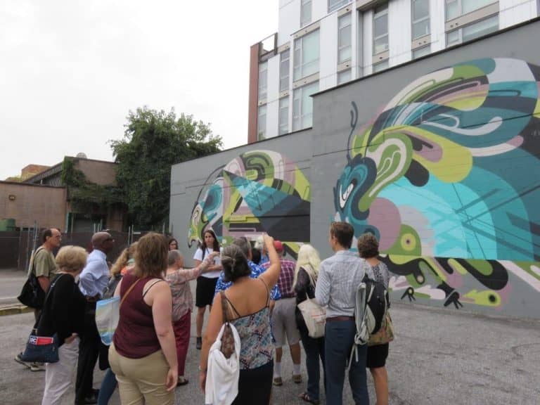 Group of people viewing mural