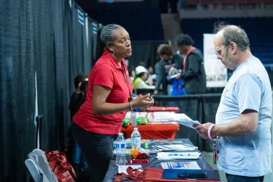 Events DC associate assisting a community member