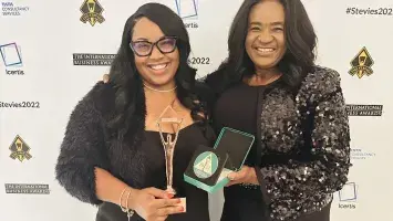 Events DC Director of Performance Excellence LaShell Mindingall and Chief Administrative Officer Misty Johnson Oratokhai accept the Stevie Award.