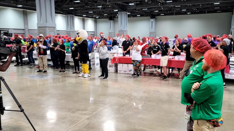More than 400 volunteers packed meals for 9/11 Day of Service.