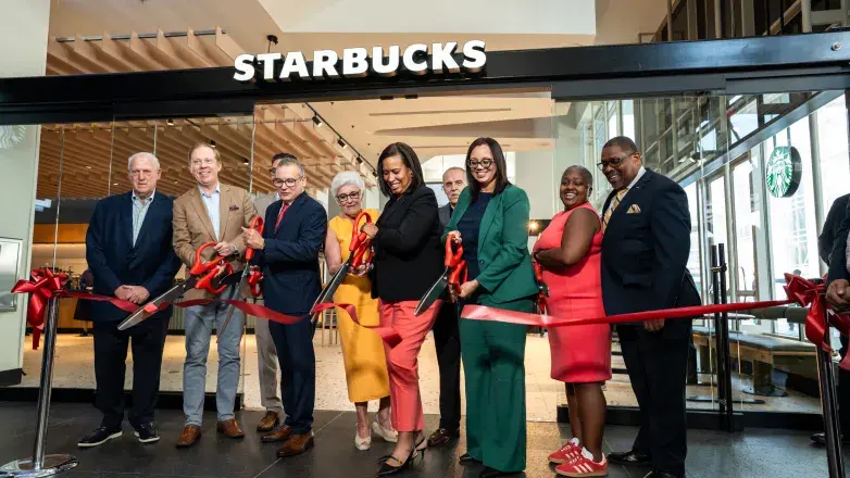 Events DC and city officials cut the ribbon in front of the new Starbucks at the Walter E. Washington Convention Center